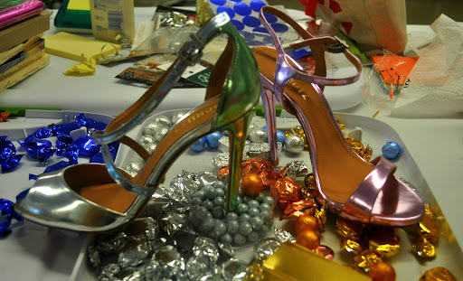 Shimmering heels from Schutz (http://www.piperlime.com/products/schutz-shoes.jsp) taking a break for candy. Shimmering heels from Schutz (http://www.piperlime.com/products/schutz-shoes.jsp) taking a break for candy.