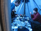 Inside the mess tent. Steven, Simina, Maggie (left to right). Breakfast day 3.