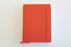 For their guestbook, a simple orange book was used. For their guestbook, a simple orange book was used.