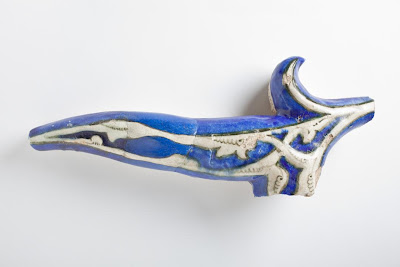Tile | Origin: Iran, Tabriz | Period: circa 1465 | Collection: The Madina Collection of Islamic Art, gift of Camilla Chandler Frost (M.2002.1.305) | Type: Ceramic; Architectural element, Fritware, molded, underglaze-painted, 12 3/8 x 5 7/8 x 2 15/16 in. (31.43 x 14.92 x 7.46 cm)