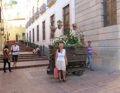 April in front of a mining card turned planter
