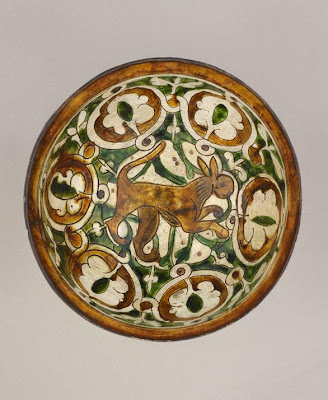 Bowl | Origin:  Iran | Period: 12th-13th century or later | Details:  Not Available | Type: Earthenware with decoration carved through a white slip and coloring under a transparent glaze | Size: H: 11.3  W: 22.6  cm | Museum Code: F1925.11 | Photograph and description taken from Freer and the Sackler (Smithsonian) Museums.