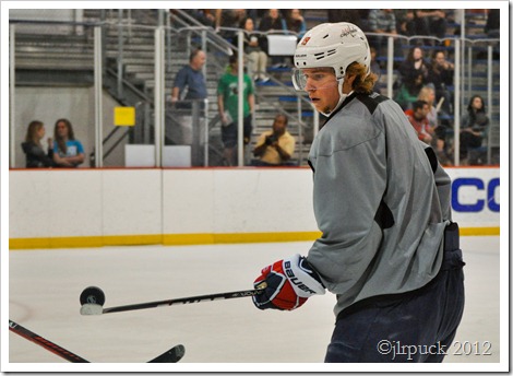 Backstrom plays with the puck