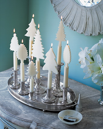 Candles adorned with beeswax trees create an enchanting winter landscape on the tabletop. Candles adorned with beeswax trees create an enchanting winter landscape on the tabletop.