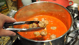 Add the meatballs to the sauce, gently because they are still fragile.