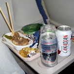 enjoying an asahi and molsen canadian on the flight in Chiba, Japan 