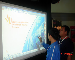 Wilhein and Sir Ervin try out a touch screen panel.