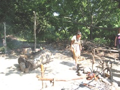 Plimoth Plant indian girl tending cooking pots