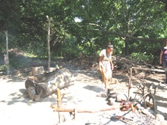 Plimoth Plant indian girl tending cooking pots Plimoth Plant indian girl tending cooking pots