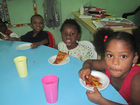 Peter, Estefani and Diana are enjoying their slices