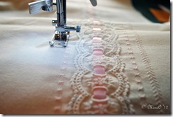 The flounce with the lace inserted and the embroidery being stitched on each side of the lace.