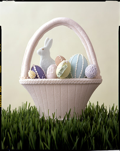 A pressed-sugar basket with piped royal-icing handle and eggs.