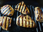 Wait until grill marks show and then turn the chicken over.