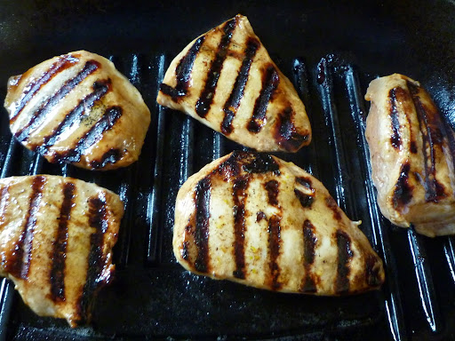 Wait until grill marks show and then turn the chicken over.