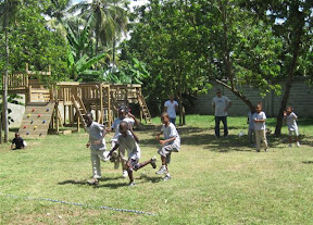 Three legged race? Memo and Franchesca try to out hop Bienvenido and Carlos.