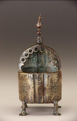 Incense burner | Origin:  Iran | Period: 12th century  Saljuq period | Details:  Not Available | Type: Brass, traces of copper inlay | Size: H: 22.8  W: 9.8  cm | Museum Code: F1977.5 | Photograph and description taken from Freer and the Sackler (Smithsonian) Museums.