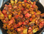 Tomatoes and spices have been added into the mix. Tomatoes and spices have been added into the mix.