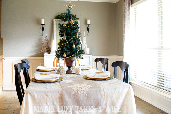 Use a table top tree to make a simple centerpiece. A delightful Dining Room Holiday Tour. See how Mrs Major Hoff decorates for Christmas. The tour features table decorations, dining room decorating ideas, place settings and an idea for homemade Christmas gift that can be personalized for your holiday guests. This post is part of the Home For The Holidays Blog Tour. Use a table top tree to make a simple centerpiece. A delightful Dining Room Holiday Tour. See how Mrs Major Hoff decorates for Christmas. The tour features table decorations, dining room decorating ideas, place settings and an idea for homemade Christmas gift that can be personalized for your holiday guests. This post is part of the Home For The Holidays Blog Tour.