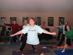 Yoga clinics hosted by Mary Ann are great fun. The ladies learn and practice yoga poses in the AM.