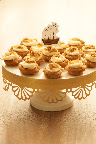These bite-sized apple pie cupcakes from Baked by Melissa, www.bakedbymelissa.com, are a huge hit with kids and adults. Style them on a cake stand easily decorated with punched gold paper. These bite-sized apple pie cupcakes from Baked by Melissa, www.bakedbymelissa.com, are a huge hit with kids and adults. Style them on a cake stand easily decorated with punched gold paper.