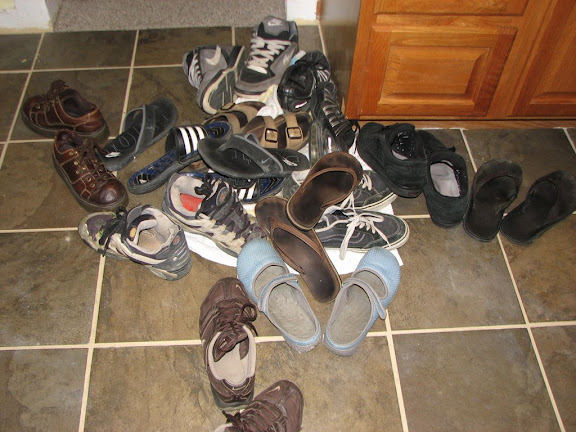 Pile of shoes after everyone came in from the rain
