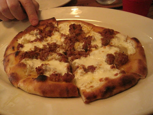 Pizza di mortadela:  shaved mortadela, honey, goat's cheese and onions