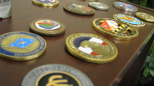 Pictured is a set of military coins on display in Stephanie Starkey's office. (photo by: Kenrick Nobles)