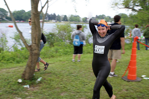 Here's me in last year's triathlon, racing toward transition after leaving the water. I'm reaching behind me for the zipper as I run!