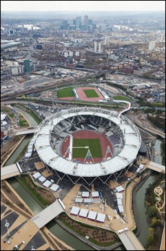 Olympic Stadium and warm-up track and Canary Wharf in the background