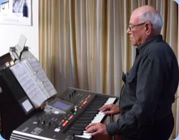 Laurie Conder giving a mini concert on his Roland G-70 music workstation