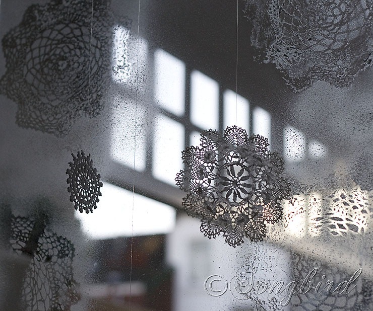 faux ice flowers on the windows made with doilies and faux ice flowers on the windows made with doilies and