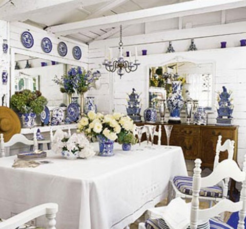 blue and white porcelain decorates a white dining room