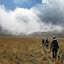 Crossing the meadow near Ranukumbolo campsite, heading back the alternative way to Ranupane