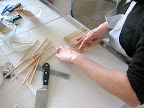 Step 2: Carefully and strategically remove the wooden sticks one by one.