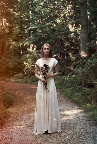 This Lindsey Thornburg ivory silk heroine gown has a racy, plunging neckline.