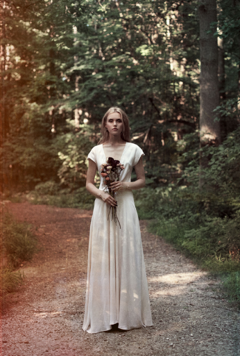 This Lindsey Thornburg ivory silk heroine gown has a racy, plunging neckline.
