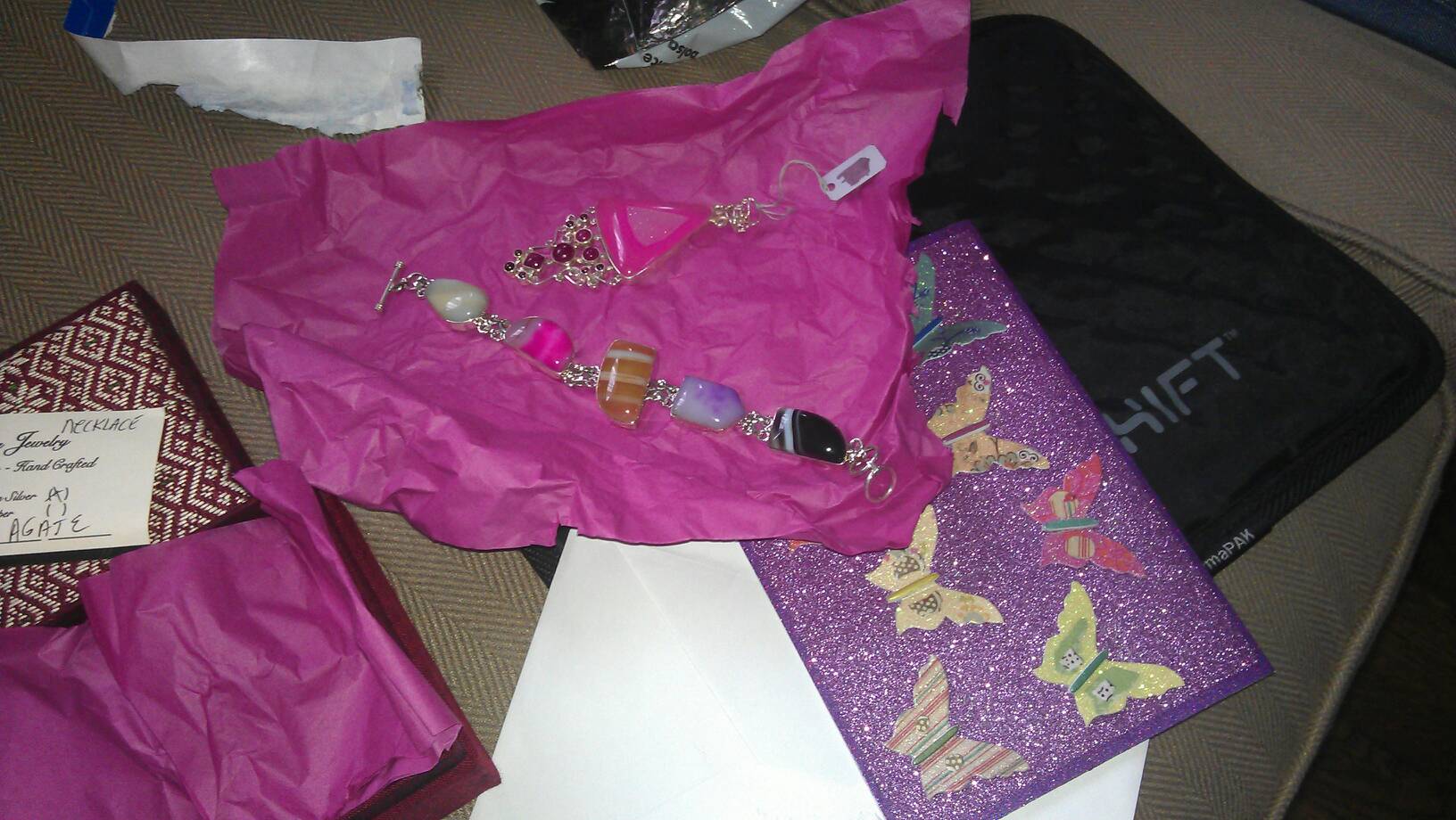 Beautiful jewelry from UNC aunt and cuz and lap top protector from mom and dad
