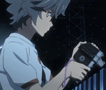 Lead protagonist Kaito messing with his old handheld camera on a bridge at night