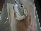 Use a spoon to spread the dough about 1/4 inch thick onto the corn husk leaving a border on the bottom and both sides