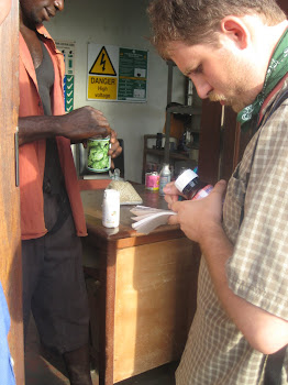 'A student inspects seeds with Alliance for a Green Revolution in Africa (AGRA), in Accra.' Photo by Sandra Vu