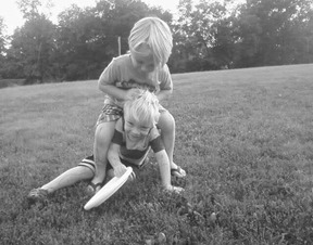 boys playing frisbee