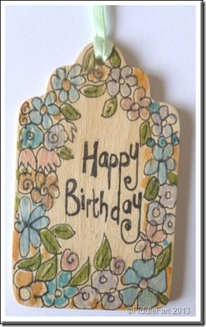 simple wooden doodled tag