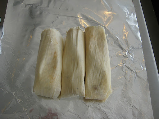 I like to wrap my tamales into pouches of three. They can also be wrapped individually if you prefer