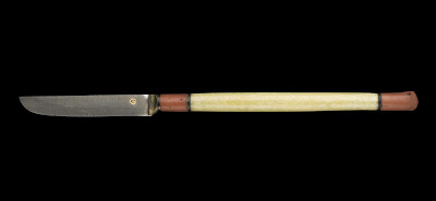 Pen knife | Origin:  Turkey | Period: 18th-19th century  Ottoman period | Details:  Not Available | Type: Walrus ivory, red coral, metal | Size: H: 21.5  W: 1.2   D: 0.9  cm | Museum Code: S1991.4 | Photograph and description taken from Freer and the Sackler (Smithsonian) Museums.