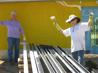 Loyce and Caroline painting beams. Sienna Project 2011 Guatemala trip to help build school in Palanquix, Solala, Guatemala. Photos by TOM HART