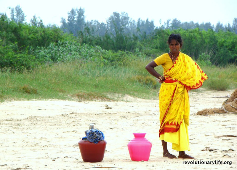 An india woman getting her water for the day. An india woman - by Revolutionary Life