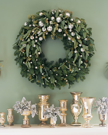 Create this glittering decoration by trimming a noble fir wreath with silvery ornaments and sprigs of seeded eucalyptus. Create this glittering decoration by trimming a noble fir wreath with silvery ornaments and sprigs of seeded eucalyptus.