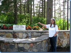 2269 Manitoba Riding Mountain National Park - Karen making a wish at Wishing Well