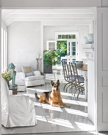 A pale palette ensures bright interiors all year -- as in this Gustavian-influenced dining room.