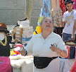 Woman selling with castagnets in Marina del Prat Vell Sunday market, CC Dovidena del Campo http://goo.gl/2sQPc